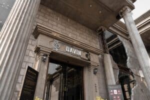 Grand entrance of Davin Cafe in Ram Inthra with industrial architecture and neoclassical pillars, showcasing the cafe’s signature style