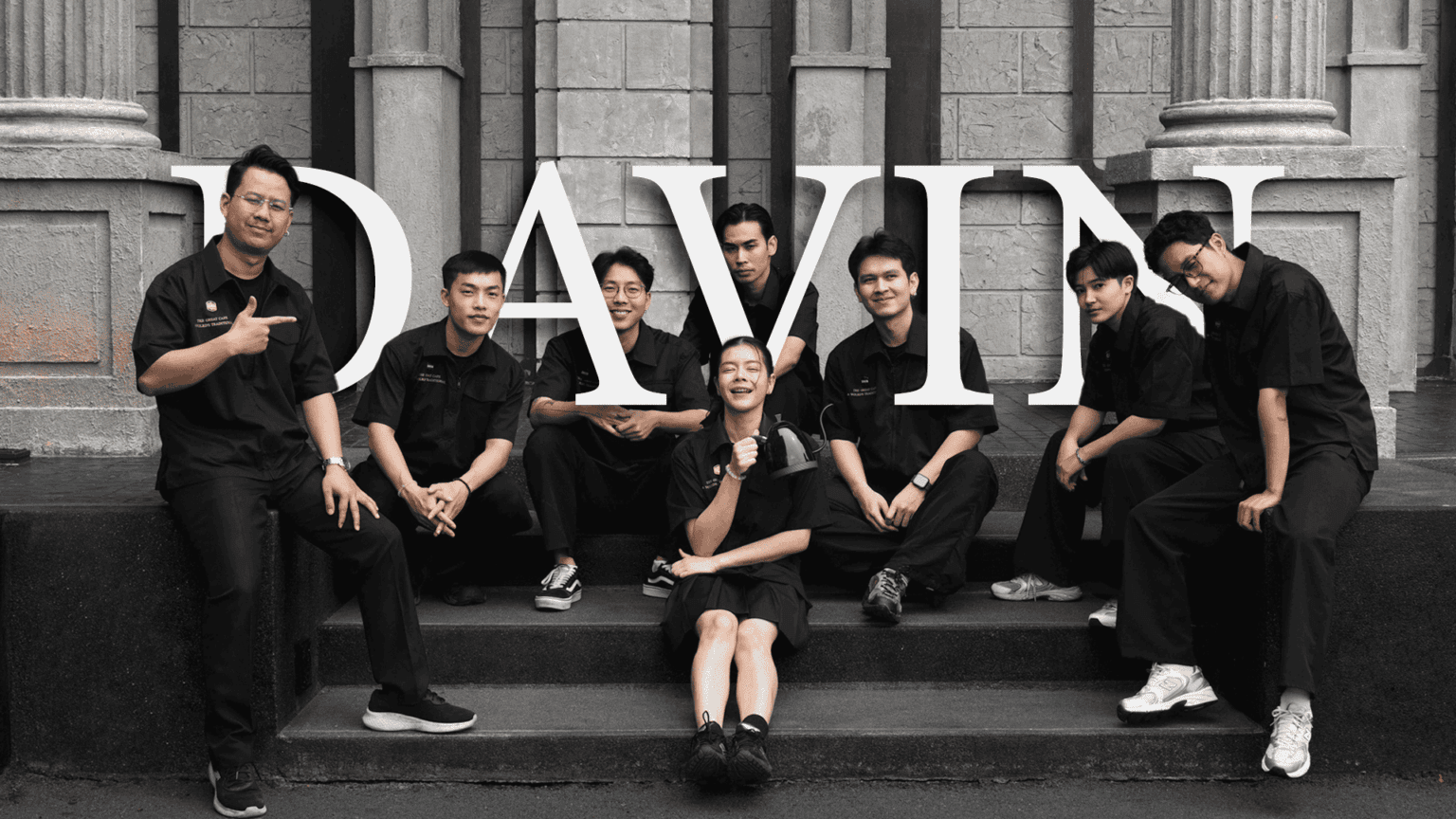 A group portrait of the Davin Cafe staff team posing together in their uniforms outside the cafe.