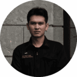 A professional portrait of a male staff member from Davin Cafe wearing a black uniform.