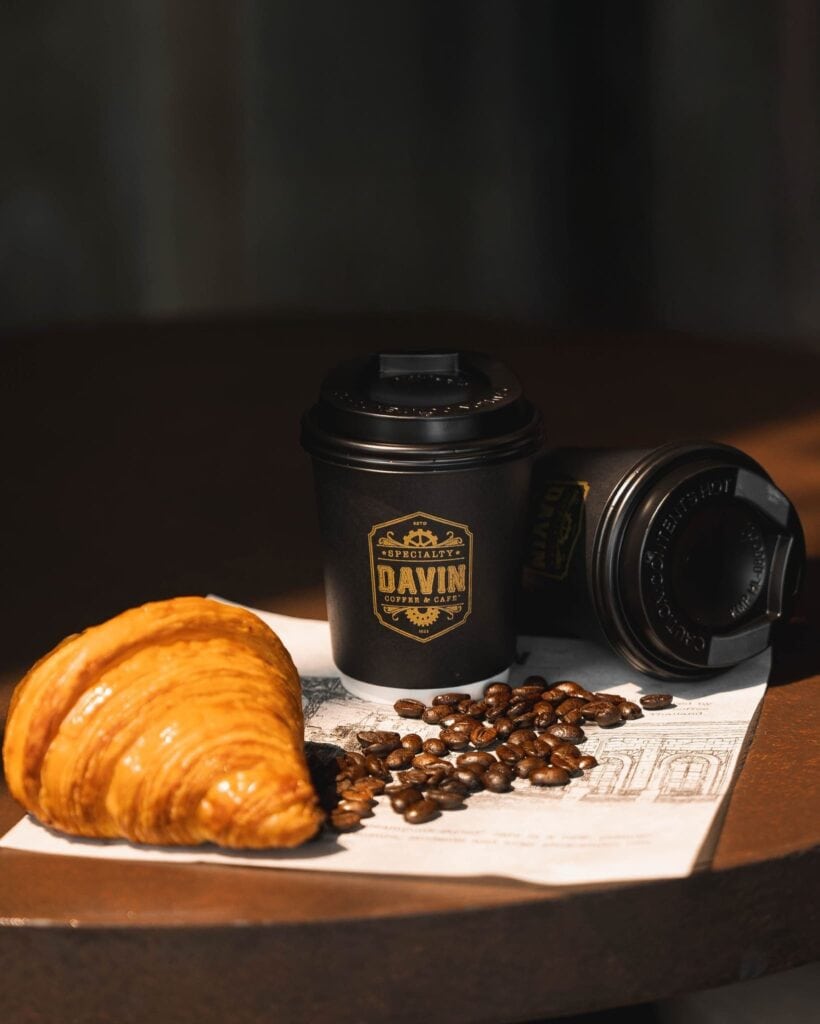 Artisan bakery croissant served with premium coffee, ideal for coffee pairing and takeaway enjoyment