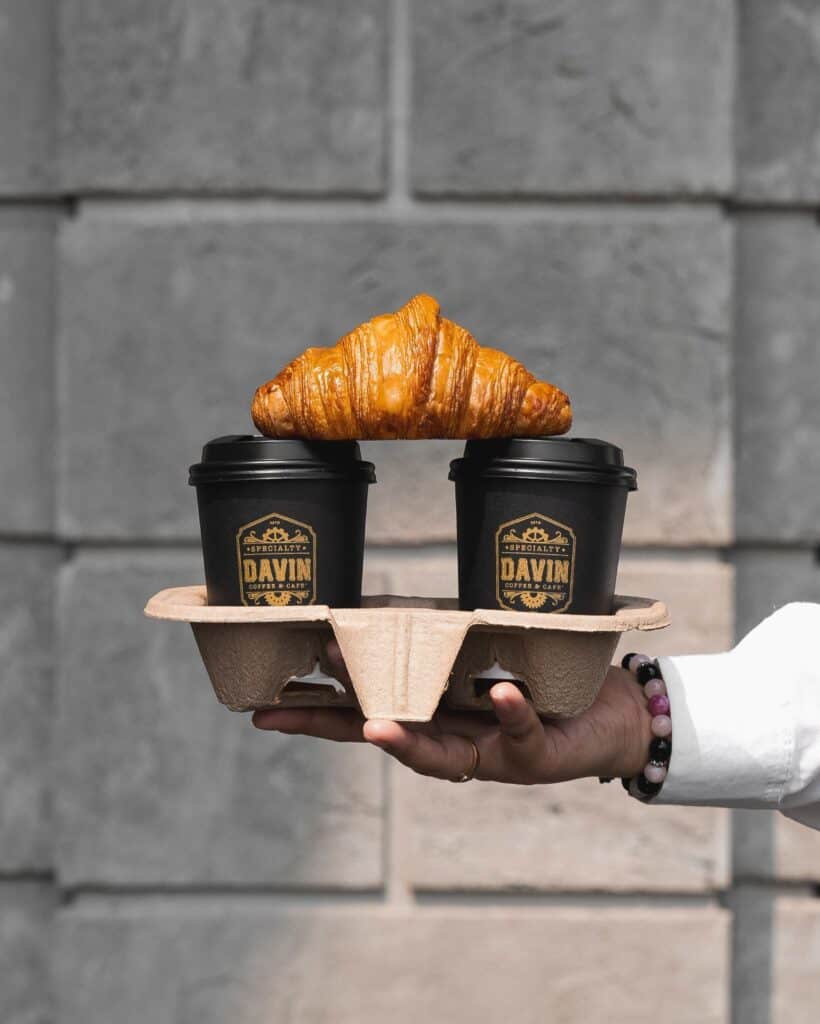 Buttery croissant bakery paired with hot coffee from Davin Cafe, perfect for grab-and-go and coffee pairing moments