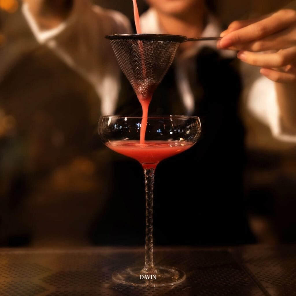 Craft cocktail being prepared at a night hangout bar, intimate evening atmosphere ideal for socializing, relaxing drinks, and premium hangout experiences