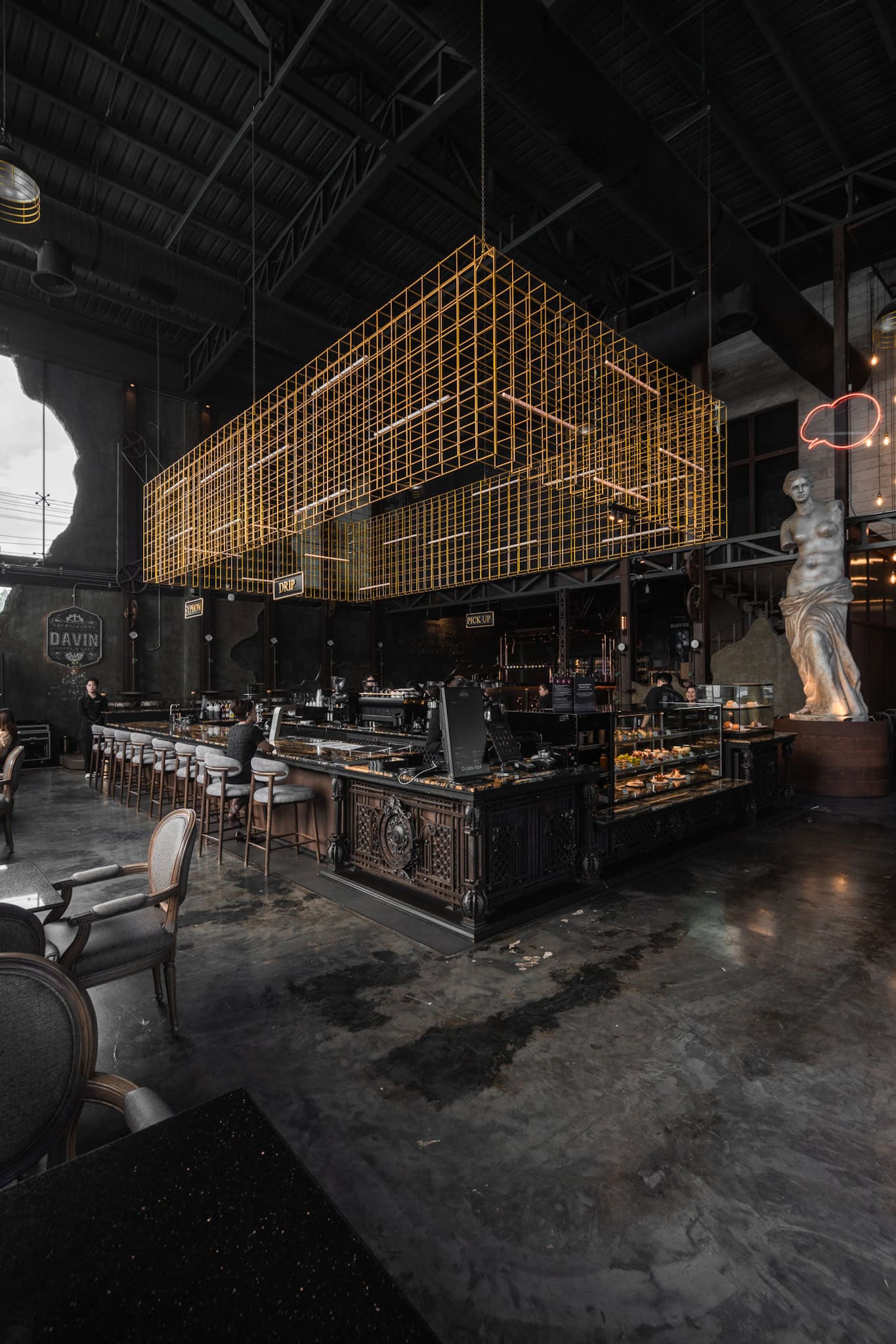 A photogenic cafe interior with industrial luxury design, high ceilings, and architectural details, perfect for wide-angle photography and lifestyle content creation
