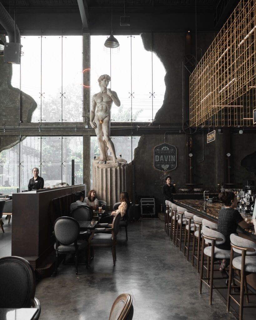Davin Cafe, a standout coffee shop in Ramintra featuring an industrial-style interior with a classical David statue, offering a unique atmosphere for specialty coffee and café experiences