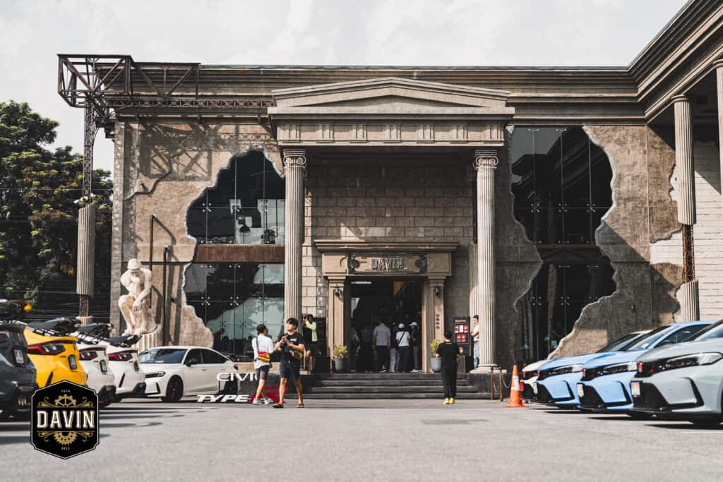 A high-performance car product display staged in front of Davin Cafe, using the venue’s architectural frontage as an open-air showcase that enhances brand presence, visual storytelling, and experiential marketing impact.