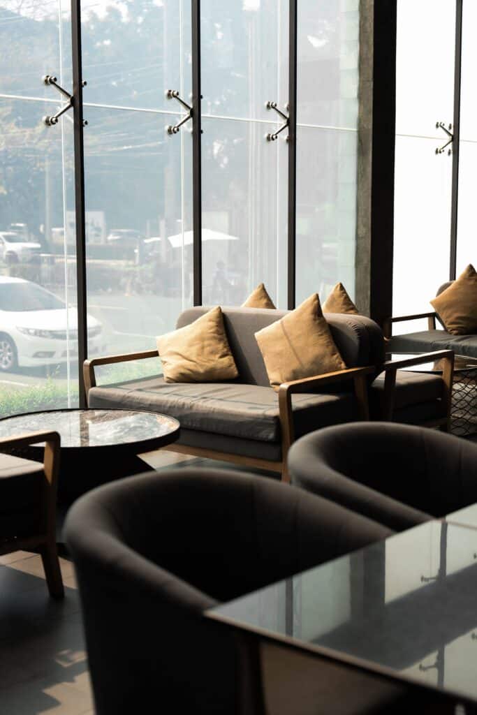 Cozy window seat inside a stylish cafe with warm natural light, ideal for a private and relaxed first date atmosphere