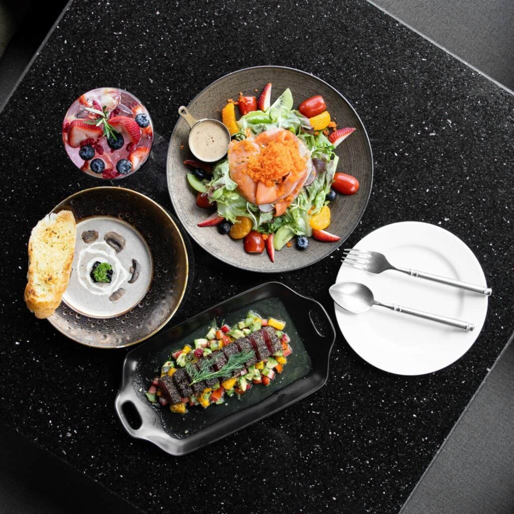 Signature dishes at Davin Cafe, a coffee shop along Liab Duan Ramintra in Bangkok featuring salmon salad, cream soup, and premium dining menu