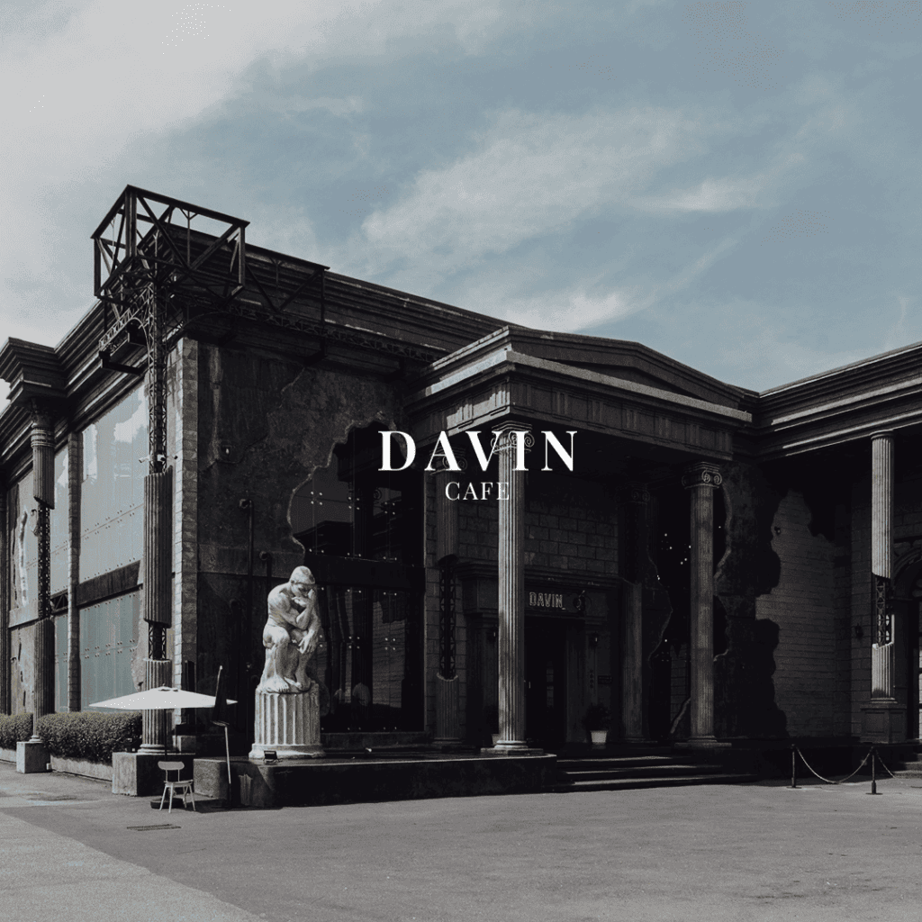 Front façade of Davin Cafe in Ramintra featuring neoclassical columns and a sculptural landmark entrance—an iconic neighborhood café destination for users searching for a distinctive café near me in Bangkok.