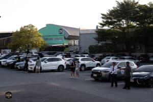 Davin Cafe event parking lot with guests and cars at The First Ultimate เที่ยวสุดโลก 2025.