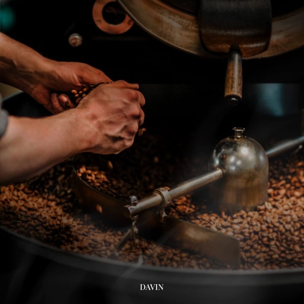 Close-up of coffee beans roasting inside a roaster at Davin Cafe in Bangkok, highlighting the craft roasting process behind the specialty coffee served in this stylish coffee shop.