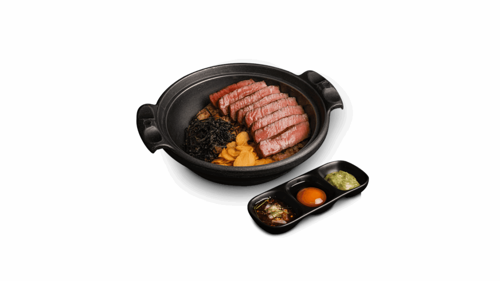 AUS BEEF FRIED RICE at DAVIN CAFE restaurant Bangkok featuring premium Australian sliced beef over hot fried rice in a clay pot, served with signature sauces and condiments, a must-try premium beef dish in Bangkok restaurant scene