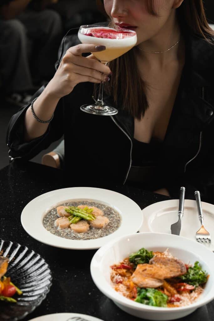A guest enjoying a refined dining moment at Davin Cafe, featuring European-inspired dishes and crafted beverages, offering a premium café experience in Bangkok