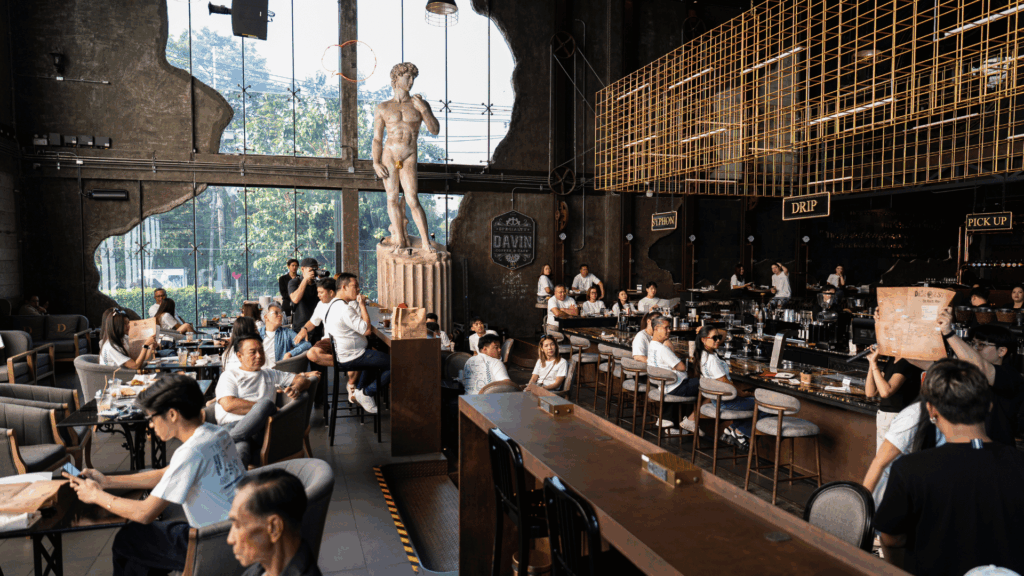 Interior of DAVIN CAFE luxury event venue during The Car Lovers Drive Quest 2026, showcasing spacious premium indoor event venue with modern cafe design, ideal for hosting large-scale events and lifestyle gatherings