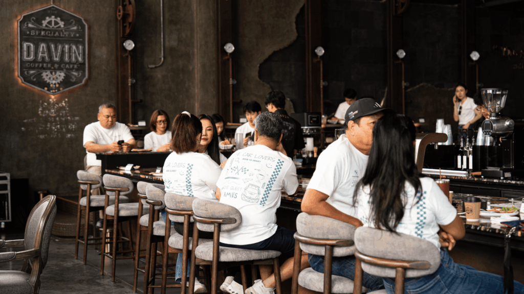 Bar area inside DAVIN CAFE premium indoor event venue during The Car Lovers Drive Quest 2026, featuring guests enjoying the experience, showcasing a stylish cafe event space ideal for lifestyle and social events