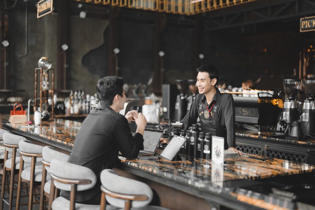 DAVIN CAFE work cafe featuring barista and customer interaction in a warm, productive environment, ideal for working, meetings and creative lifestyle with specialty coffee