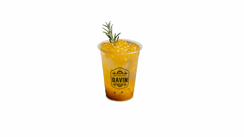 PASSION FRUIT REFRESHER at DAVIN CAFE cafe, tropical sparkling passion fruit drink with golden passionfruit boba and rosemary garnish, sweet and tangy refreshing beverage for cafe lovers