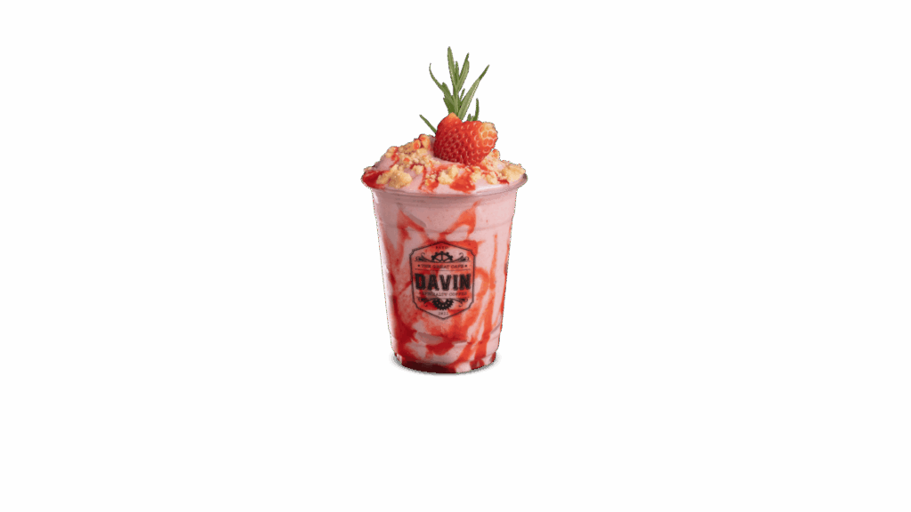 STRAWBERRY CHEESECAKE at DAVIN CAFE cafe, creamy blended strawberry cheesecake drink with fresh strawberry topping and crumble, sweet tangy premium dessert beverage for cafe lovers
