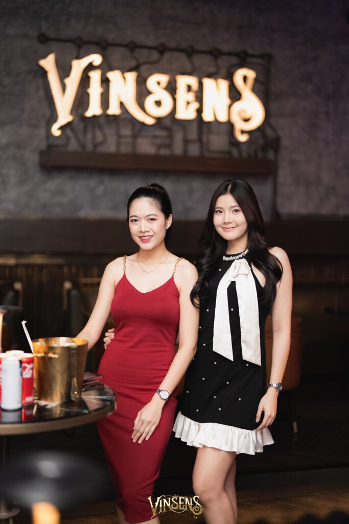 Guests enjoying a relaxed social evening at Vinsens, a popular chill bar in Ramintra, Bangkok, showcasing a welcoming ambiance, stylish crowd, and an elevated nightlife experience for urban hangouts