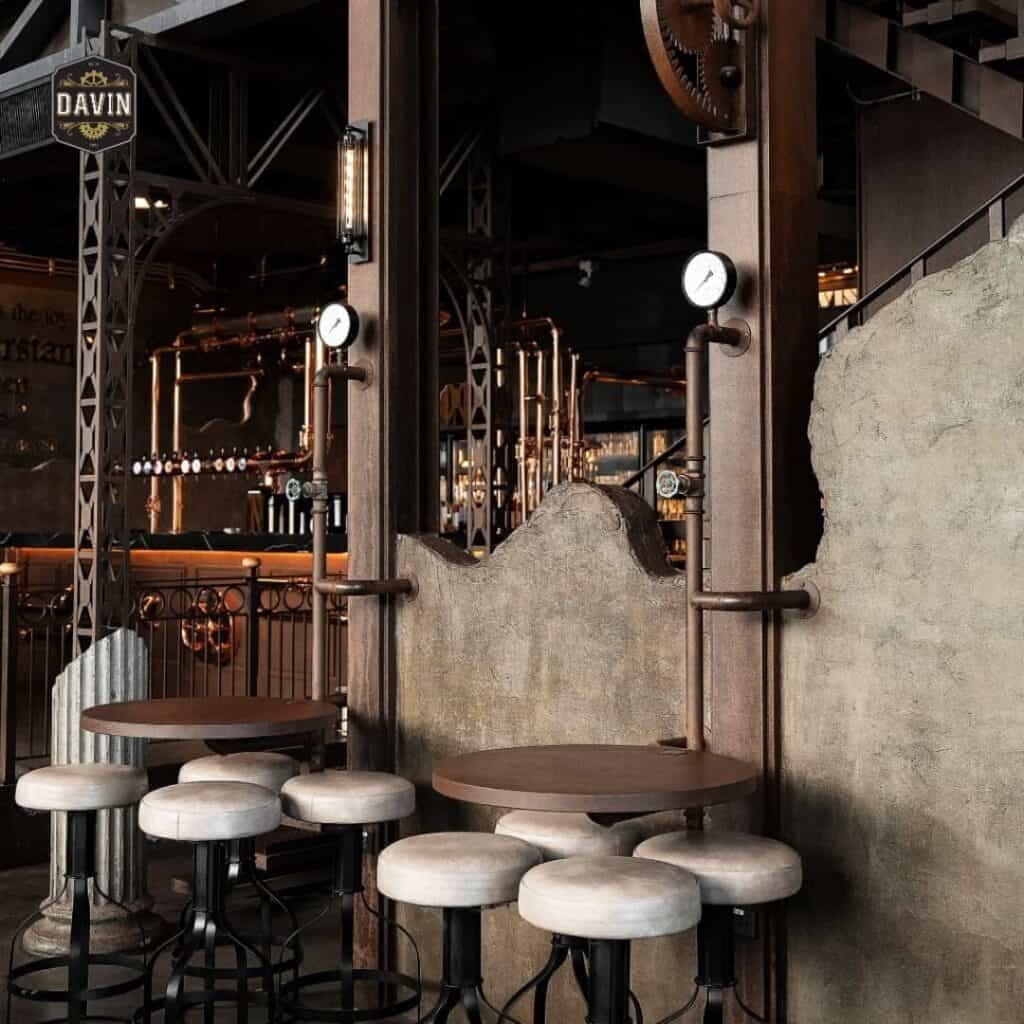Industrial-style private seating at DAVIN CAFE, a Restaurant with Great Atmosphere Bangkok, featuring loft-inspired design, cozy tables, and a warm ambiance ideal for dinner, coffee, meetings, and relaxing moments in Bangkok.