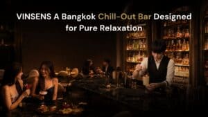 Hero image of VINSENS, a stylish chill bar in Bangkok with warm lounge lighting, a bartender crafting drinks, and guests enjoying cocktails and conversations, capturing a relaxed yet refined nightlife setting for after-work drinks, casual dinners, and social evenings.