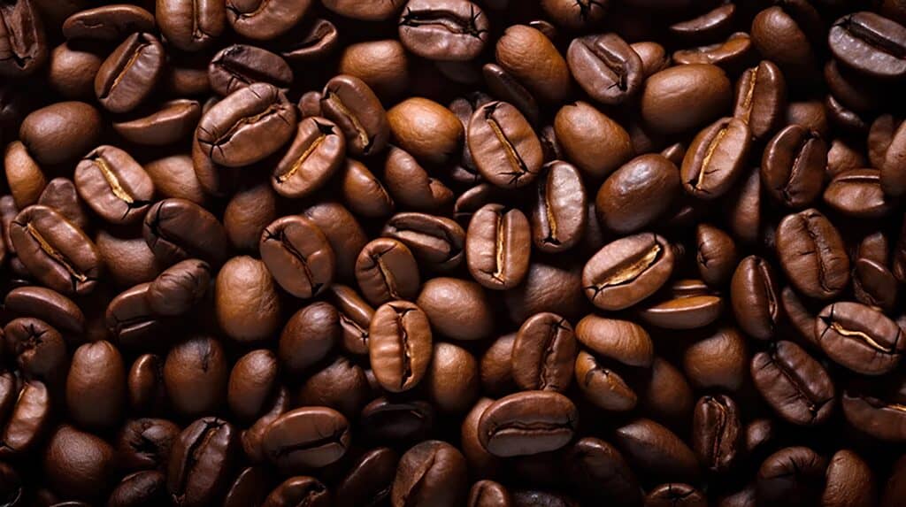 Close-up texture of roasted coffee beans with rich brown tones and visible surface details, representing the Flavor Exchange experience through coffee aroma, roast character, tasting notes, and specialty coffee exploration.
