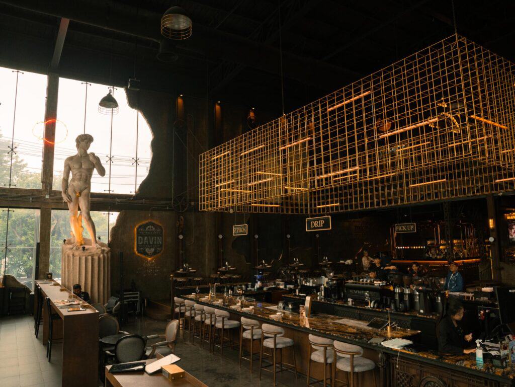 European style cafe Bangkok at DAVIN CAFE featuring a grand coffee bar, high ceilings and European-inspired Industrial Loft interior