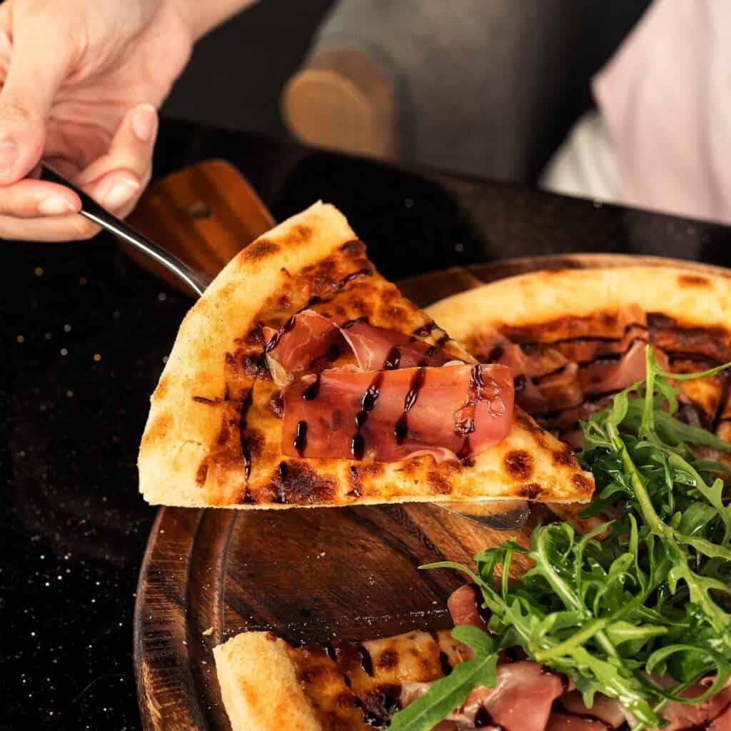 Italian restaurant at DAVIN CAFE serving prosciutto and rocket pizza for lunch