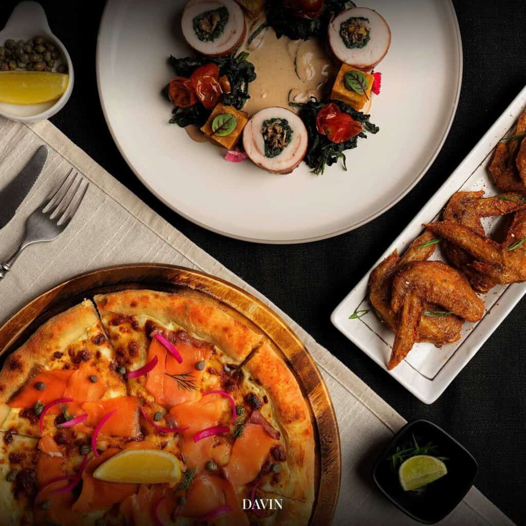 Italian restaurant lunch at DAVIN CAFE featuring smoked salmon pizza and a selection of dishes served for sharing