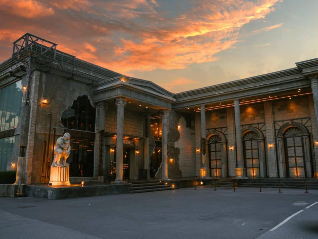 DAVIN CAFE exterior at sunset, a Golden Hour Cafe in Ramintra featuring European-style architecture under a golden evening sky